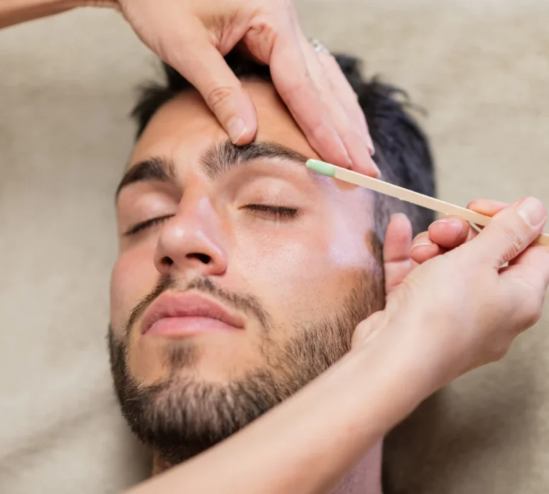 crop-beautician-waxing-eyebrows-of-male-client-2023-11-27-05-24-46-utc